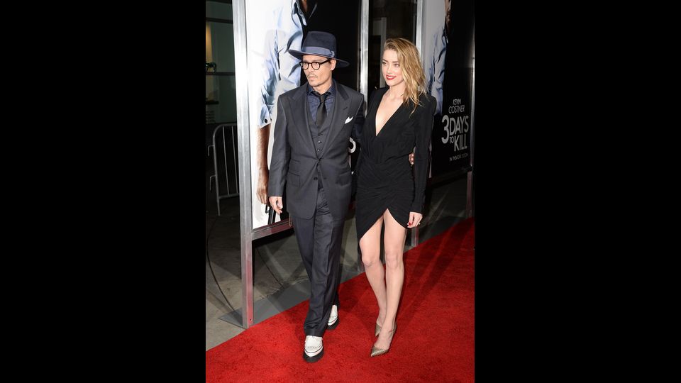 Depp e Amber Heard arrivano alla prima di &quot;3 giorni per uccidere&quot; &nbsp;nel febbraio 2014 a Hollywood, California (Afp)