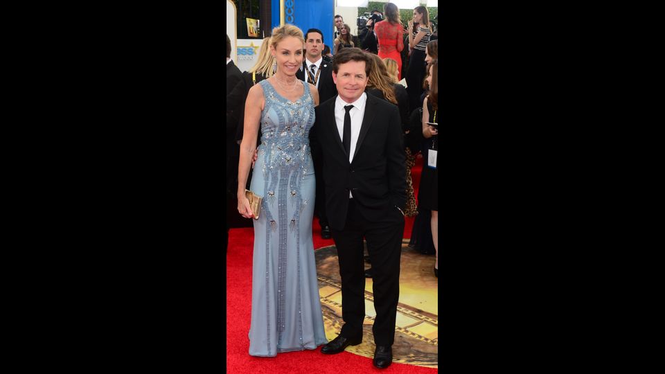 2014: l'attore con la moglie Tracy Pollan sul red carpet del 71mo Annual Golden Globe Awards a Beverly Hills (Afp)