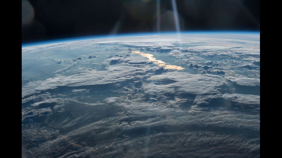 &nbsp;Beams of Light on a Golden Lake, image taken by the Expedition 47 crew on May 31,2016, from the International Space Station looks from northwestern China on the bottom intoeastern Kazakhstan courtesy of NASA