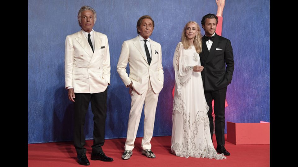 Franca Sozzani con Giancarlo Giammetti, Valentino e Francesco Corazzini (foto Afp)&nbsp;