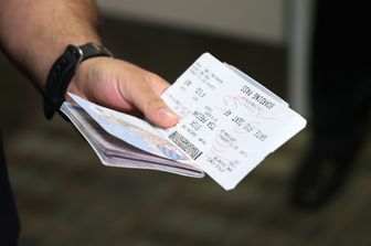 Passaporto e carta di imbarco (Afp)