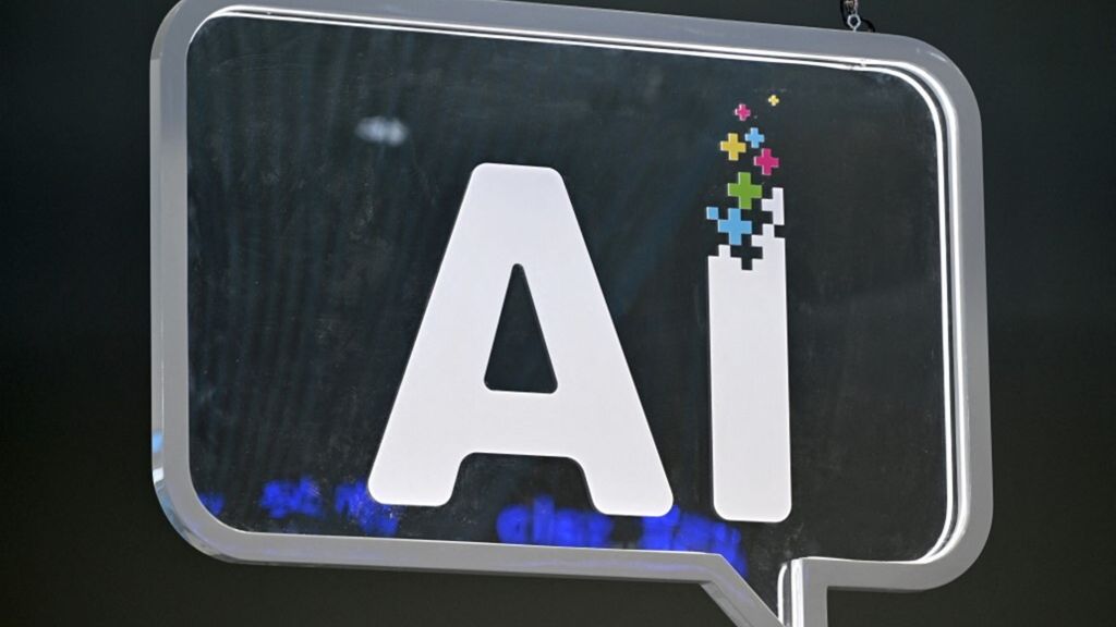 Un logo AI (intelligenza artificiale) è raffigurato al Mobile World Congress (MWC) di Barcellona
