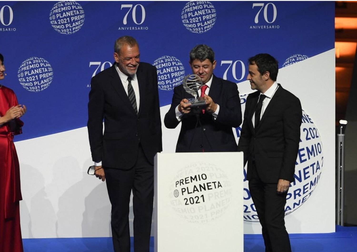 Winners of Spain's 2021 Premio Planeta award Jorge Diaz, Antonio Mercero and Augustin Martinez receive the trophy for their novel "La Bestia", written under the pseudonym Carmen Mola