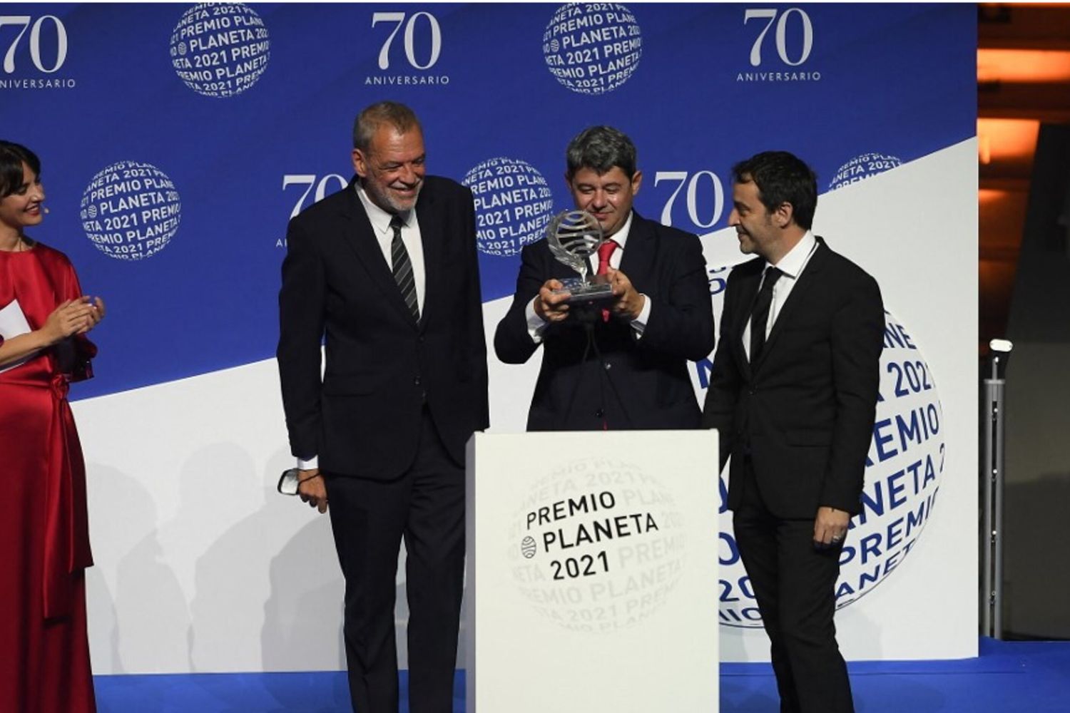 Winners of Spain's 2021 Premio Planeta award Jorge Diaz, Antonio Mercero and Augustin Martinez receive the trophy for their novel "La Bestia", written under the pseudonym Carmen Mola