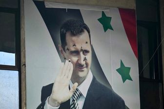 Poster di Assad bucato da proiettili ad Aleppo