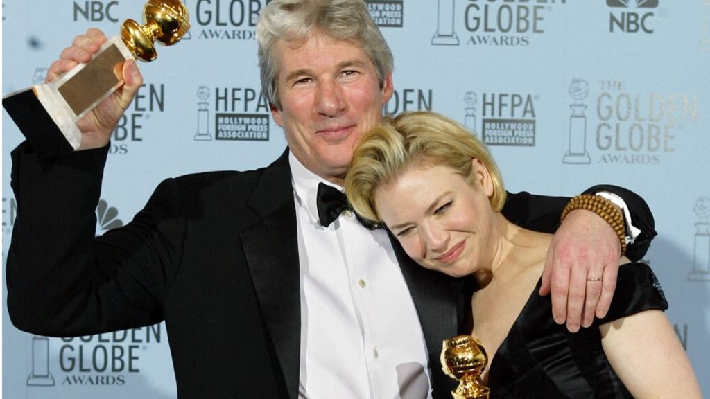 Richard Gere (L) hugs his co-star Renee Zellweger