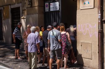 Poveri alla mensa della Caritas